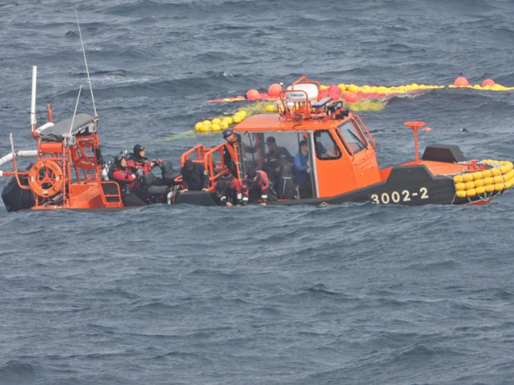 A Coast Guard vessel searches for missing crew members aboard the 129-ton Geumseong that sank off Jeju Island the previous day, in this photo provided by the Jeju Coast Guard, Nov. 9. Yonhap